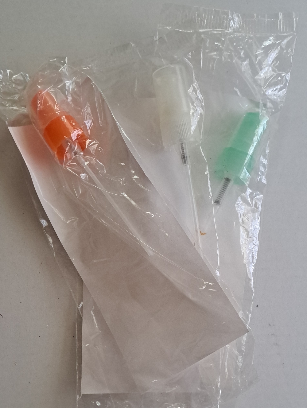 Avon, Set of 3 Spray Bottle Nozzle Caps in Orange, White, and Mint Green